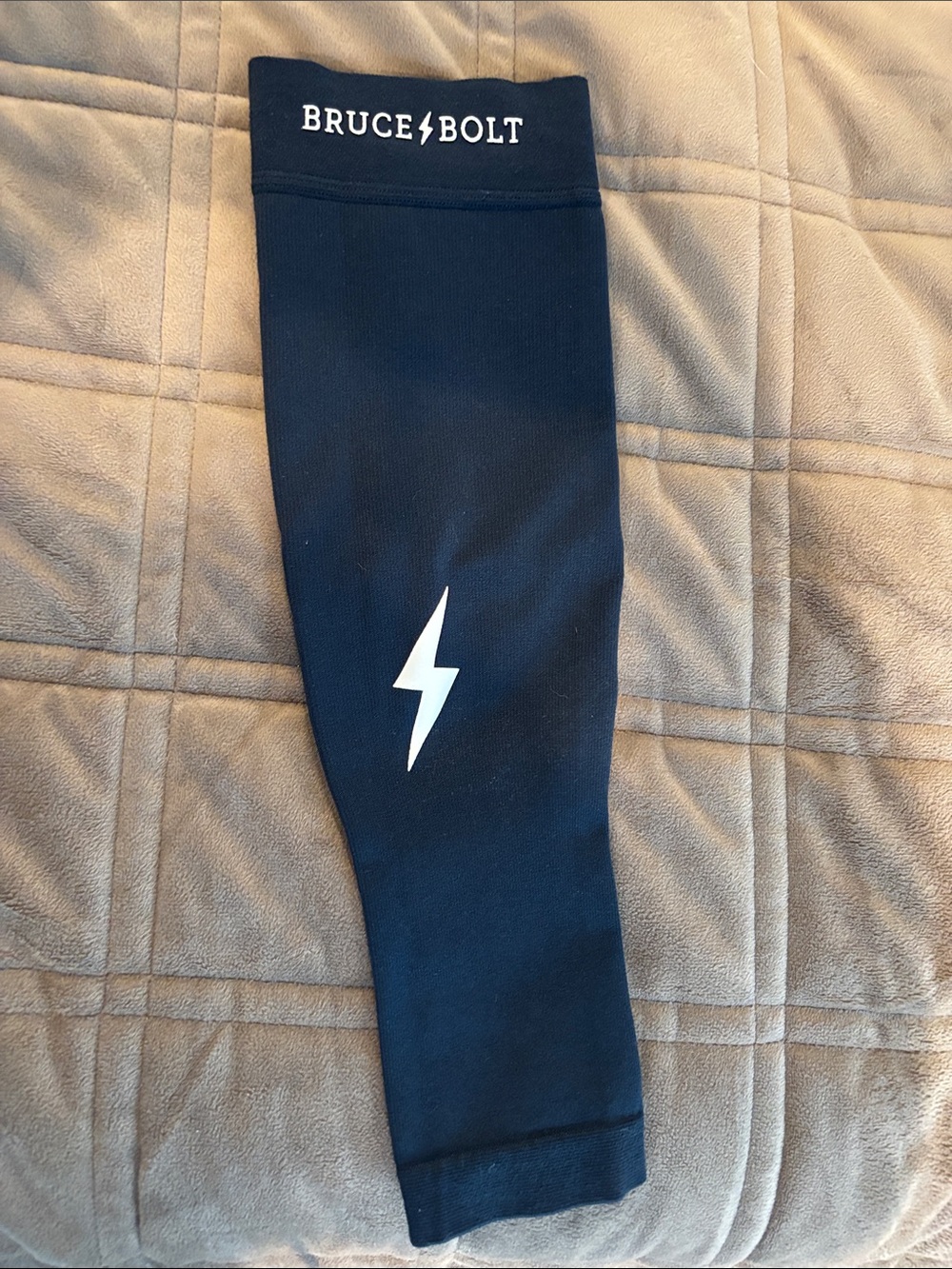 Bruce Bolt Navy Arm Sleeve with White Lightning Bolt- like new, size adult S/M